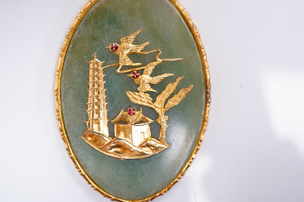 A gilt metal mounted Chinese hardstone pendant. Condition - fair to good